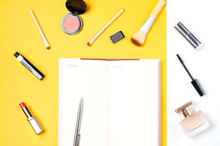 Fashion blogger objects flat lay. Blank open note book with to do list.の写真素材
