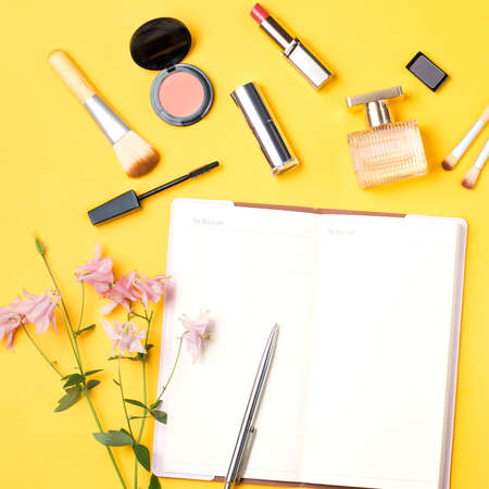 Beauty blogger objects flat lay. Beauty products and stylish female accessories on pastel backgroundの写真素材