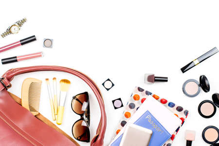 Woman bag stuff, travel concept. Beauty products, trendy accessories, passport, smartphone, copy spaceの写真素材