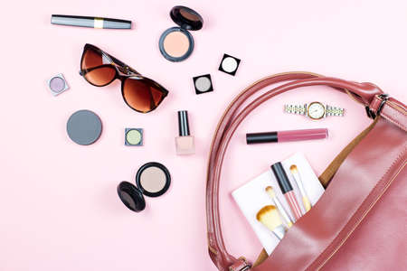 Fashion woman feminine flat lay with beauty products and accessories on pink background, copy space,の写真素材