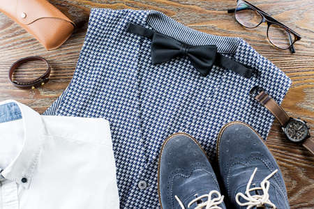 Men stylish casual clothing and accessories on wooden background.の写真素材