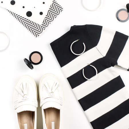 Casual style woman clothes and fashion accessories flat lay. Trendy patterns and prints concept. Top viewの写真素材