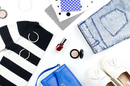 Casual style woman clothes and fashion accessories flat lay. Trendy patterns and prints concept. Top viewの写真素材