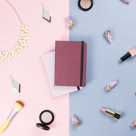 Note book, woman beauty accessories flat lay on pastel background. Fashion or beauty blogger concept.の写真素材