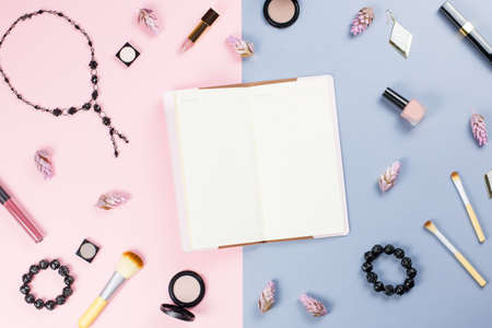 Note book, woman beauty accessories flat lay on pastel background. Fashion or beauty blogger concept.の写真素材