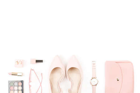 Fashion blogger workspace flat lay with pumps, cosmetics, purse, sunglasses.の写真素材