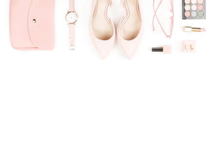 Fashion blogger workspace flat lay with pumps, cosmetics, purse, sunglasses.の写真素材