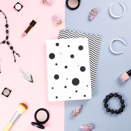 Note book, woman beauty accessories flat lay on pastel background. Fashion or beauty blogger concept.の写真素材