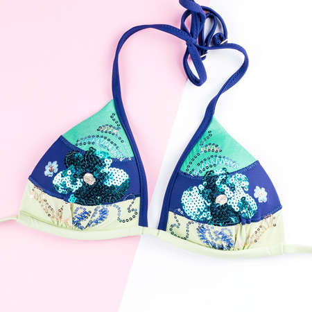 Summer holiday background. Summer concept with fashion accessories bikini on pastel background.の写真素材