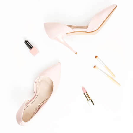 Fashion blogger workspace flat lay with pumps, cosmetics close upの写真素材