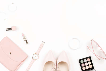 Fashion blogger workspace flat lay with pumps, cosmetics, purse, planner book.の写真素材