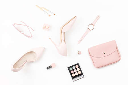Fashion blogger workspace flat lay with pumps, cosmetics, purse, planner book. Top viewの写真素材