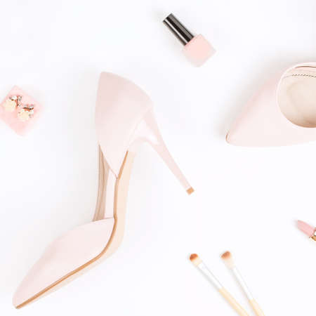 Fashion blogger workspace flat lay with pumps, cosmetics, purse, planner book. Top viewの写真素材
