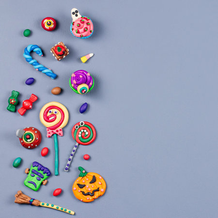 Halloween background with decorations. Black cat, bats, witches hat and broomstick with orange...