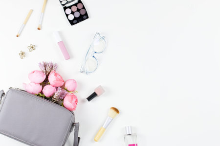 Beauty blog concept flat lay. Fashion accessories, flowers, and cosmetics. Top viewの写真素材