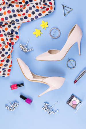 Woman autumn clothes, cosmetics and accessories flat lay. Female fall fashion concept. Top viewの写真素材