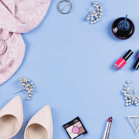 Woman autumn clothes, cosmetics and accessories flat lay. Female fall fashion concept. Top viewの写真素材