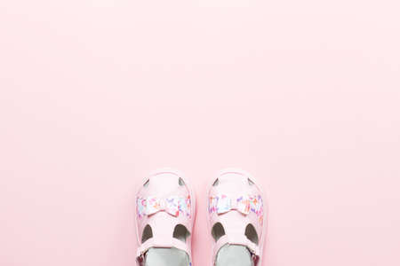 Baby girls accessories - sandals, toys. Childhood concept flat lay. Top viewの写真素材