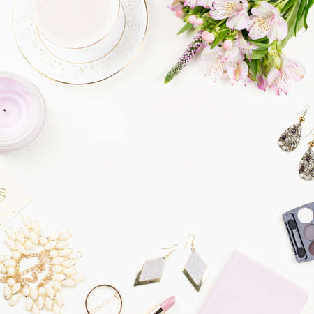 Feminine flat lay with women fashion accessories, jewelry, cosmetics, coffee and flowers.の写真素材