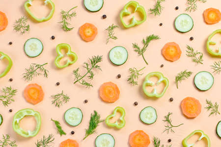 Salad ingredients layout. Food pattern with carrot, cucumbers, radish, greens, pepper and spices, top viewの写真素材