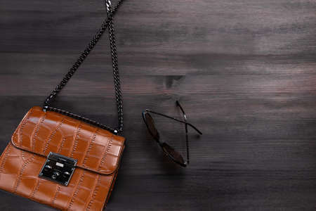 Woman crocodile leather purse or handbag on chain closeup, top viewの写真素材