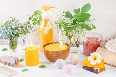Natural body care products and accessories lay out with flowers and leaves. Eco friendly spa, beauty cosmetics concept with copy space.の写真素材