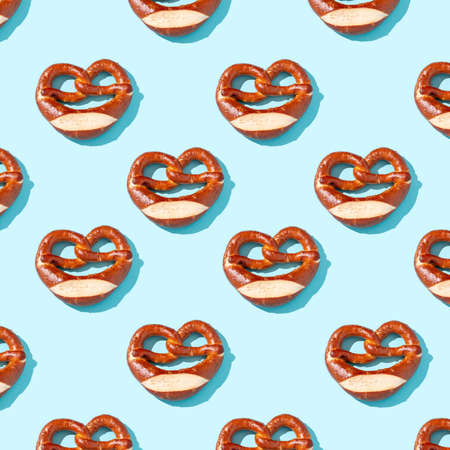 Oktoberfest pretzels pattern on blue background, top viewの写真素材