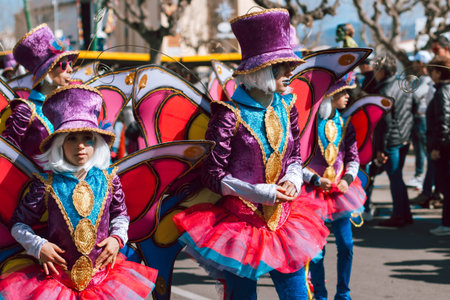 Empuriabrava, Spain - March 1, 2020. Dancing people in vibrant costumes during carnival in Spain