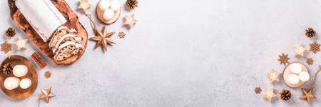 Christmas Stollen web banner with golden decor and candles, copy spaceの写真素材