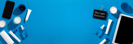 Skin care cosmetics protecting from gadgets blue light on blue background, web banner