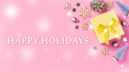 Winter holidays greeting card with golden gift box and quote Happy Holidays on pink
