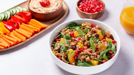 Vegan or veganuary feast with various salads ad healthy plates on light gray tableの写真素材