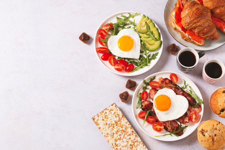 Couple breakfast border on Valentines Day on gray background, top viewの写真素材