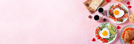 Couple breakfast border on Valentines Day on pink background, top viewの写真素材