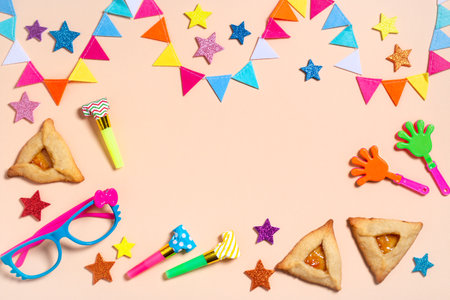 Purim frame, carnival background with traditional cookies, costume accessories and decor on bright light background, web banner, copy spaceの写真素材