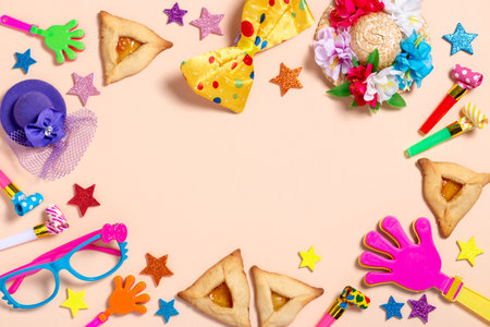 Purim carnival background with traditional cookies, costume accessories and decor on bright light backgroundの写真素材