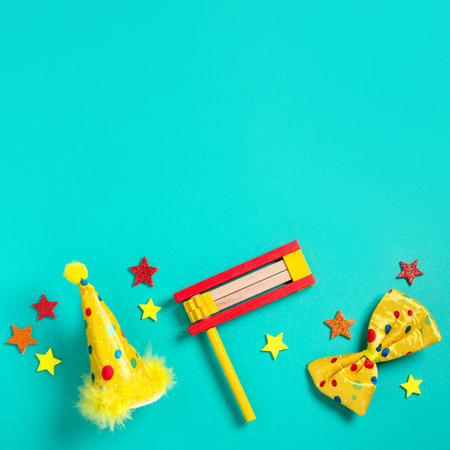 Purim carnival frame with traditional cookies, costume accessories and decor on bright green backgroundの写真素材