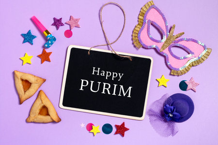 Square purim carnival background with traditional cookies, costume accessories and decor on pastel violetの写真素材