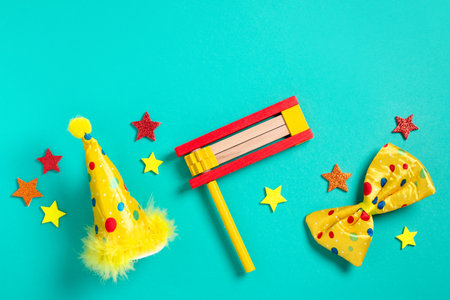 Purim carnival frame with traditional cookies, costume accessories and decor on bright green backgroundの写真素材