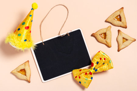 Purim carnival background with traditional cookies, costume accessories and decorの写真素材