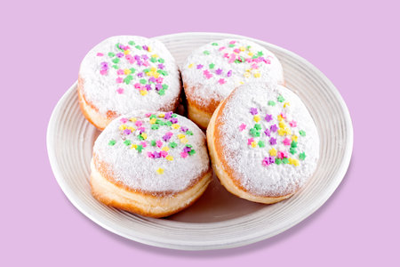 Carnival sprinkled doughnuts and confetti, holiday celebration, baking, top viewの写真素材