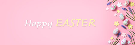 Easter card with flower design eggs, hyacinths, flower decor on pastel pink background with Happy Easter quote, Easter frame in pastel colors, top viewの写真素材