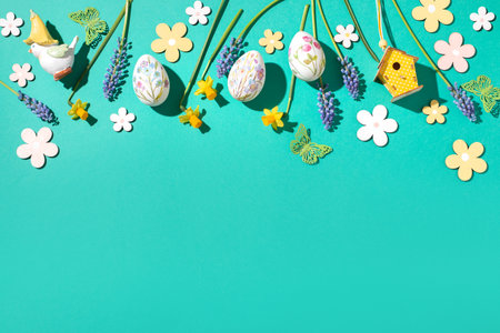 Easter border web banner with flower design eggs, hyacinths, flower decor on spring vibrant green background, Easter frame, top viewの写真素材