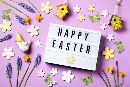 Easter card with flower design eggs, hyacinths, flower decor on pastel pink backgroundの写真素材