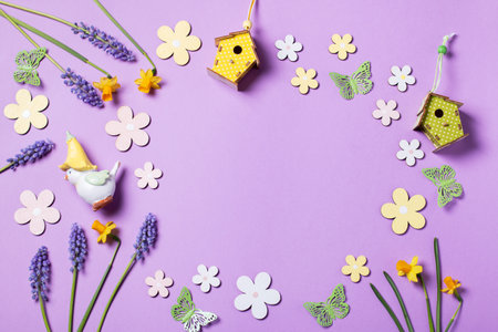 Easter card with flower design eggs, hyacinths, flower decor on pastel purple backgroundの写真素材