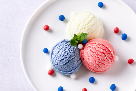 Patriotic colors ice cream scoops on white plate, top viewの写真素材