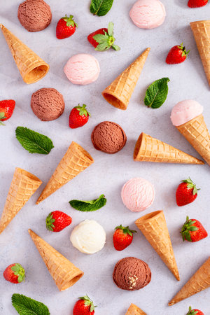 Ice cream cones frame flat lay on light gray tableの写真素材