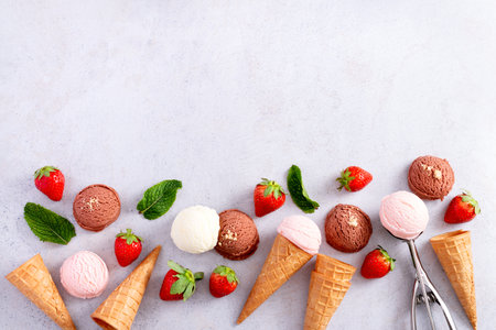 Ice cream cones frame flat lay on light gray tableの写真素材