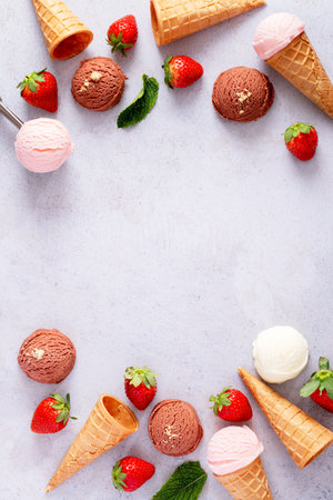 Ice cream cones frame flat lay on light gray tableの写真素材