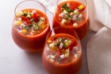 Spanish tomato gazpacho cold soup styled and decorated in glassesの写真素材